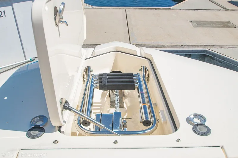 Slide: The Image of 2017 Scout 275 Dorado boat ladder compartment, open at dockside. - 24