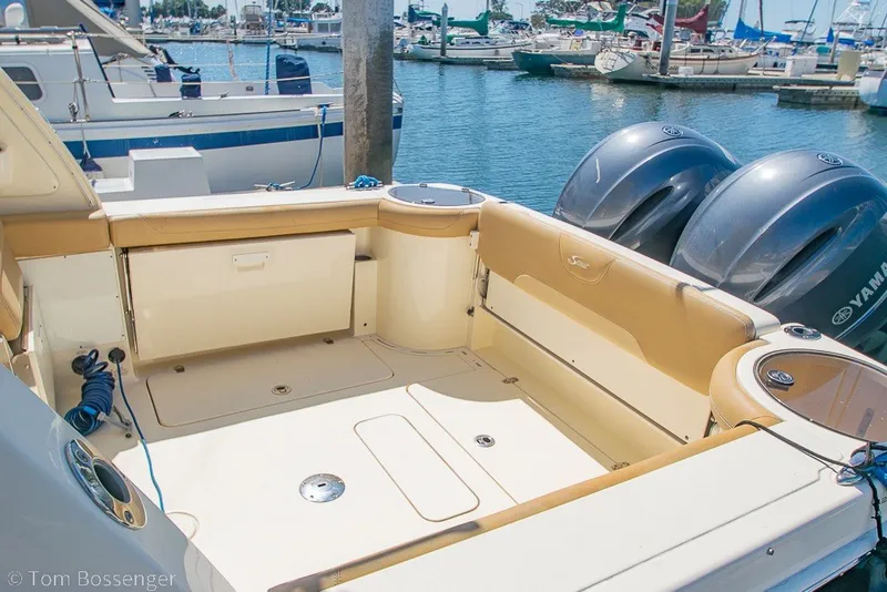 Slide: The Image of 2017 Scout 275 Dorado boat interior with Yamaha engines at marina. - 11