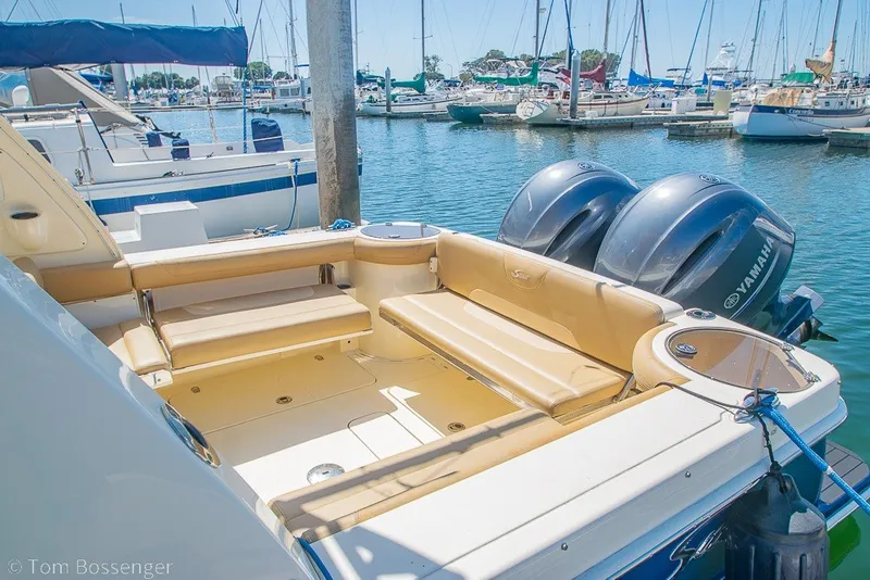 Slide: The Image of 2017 Scout 275 Dorado boat with Yamaha engines docked at a marina. - 16
