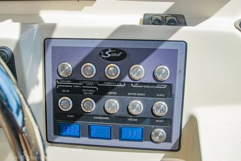 Slide: The Image of Control panel of a 2017 Scout 275 Dorado boat with labeled buttons and displays. - 34