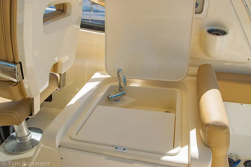 Slide: The Image of 2017 Scout 275 Dorado boat interior with open sink and seating area. - 37