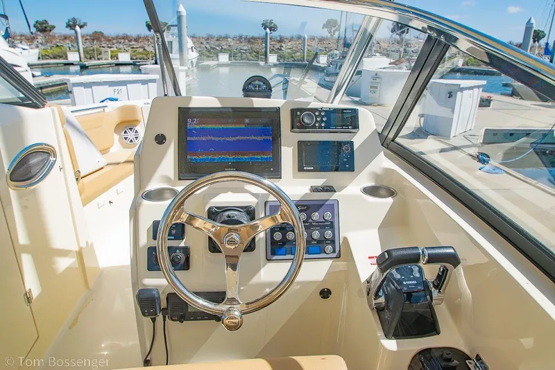 Slide: The Image of Helm of 2017 Scout 275 Dorado boat with advanced navigation controls and displays. - 29