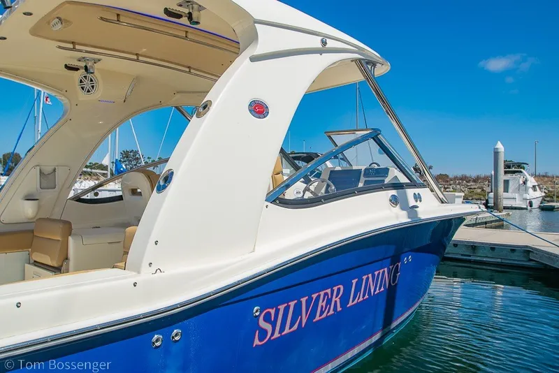 Slide: The Image of 2017 Scout 275 Dorado boat named "Silver Lining" docked at marina. - 7