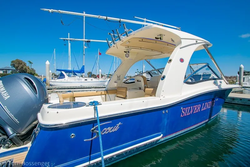 Slide: The Image of 2017 Scout 275 Dorado boat docked in marina, featuring Yamaha engine. - 6