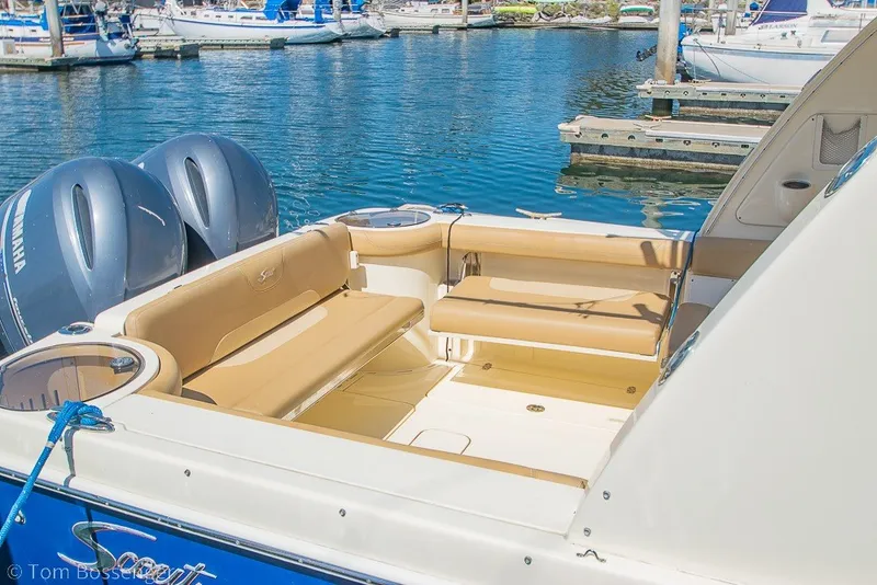 Slide: The Image of 2017 Scout 275 Dorado boat interior with seating, docked at marina. - 17