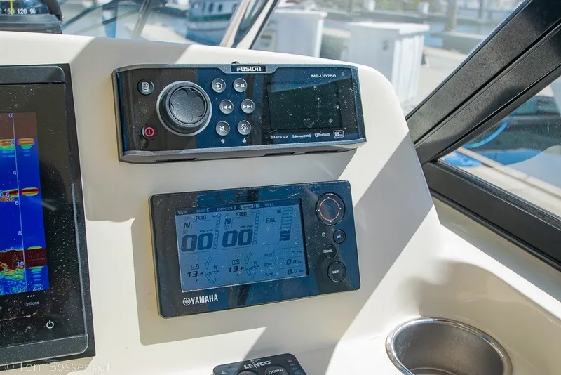 Slide: The Image of Control panel of a 2017 Scout 275 Dorado boat with Yamaha and Fusion displays. - 33