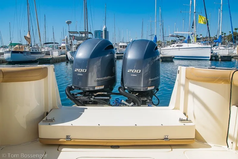 Slide: The Image of 2017 Scout 275 Dorado boat with twin Yamaha 200 engines docked in a marina. - 19