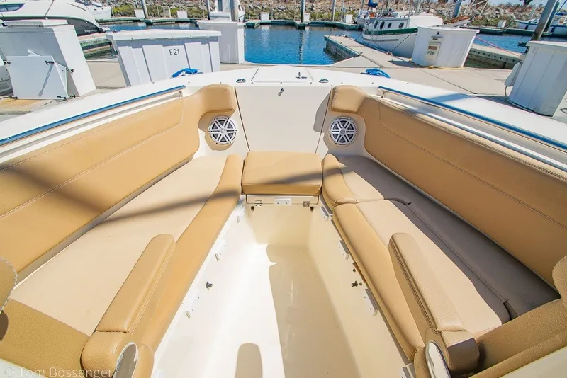 Slide: The Image of Spacious seating area on a 2017 Scout 275 Dorado boat at the marina. - 20
