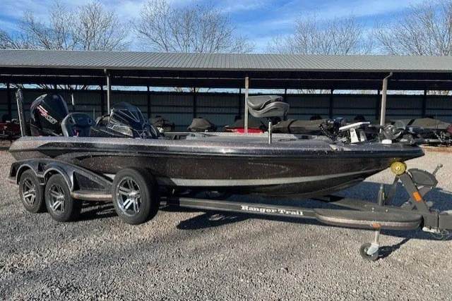 Slide: The Image of 2024 Ranger Z521R bass boat on trailer, parked outdoors. - 5