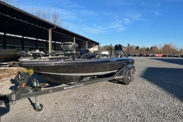 Slide: The Image of 2024 Ranger Z521R boat on trailer in outdoor storage area. - 7