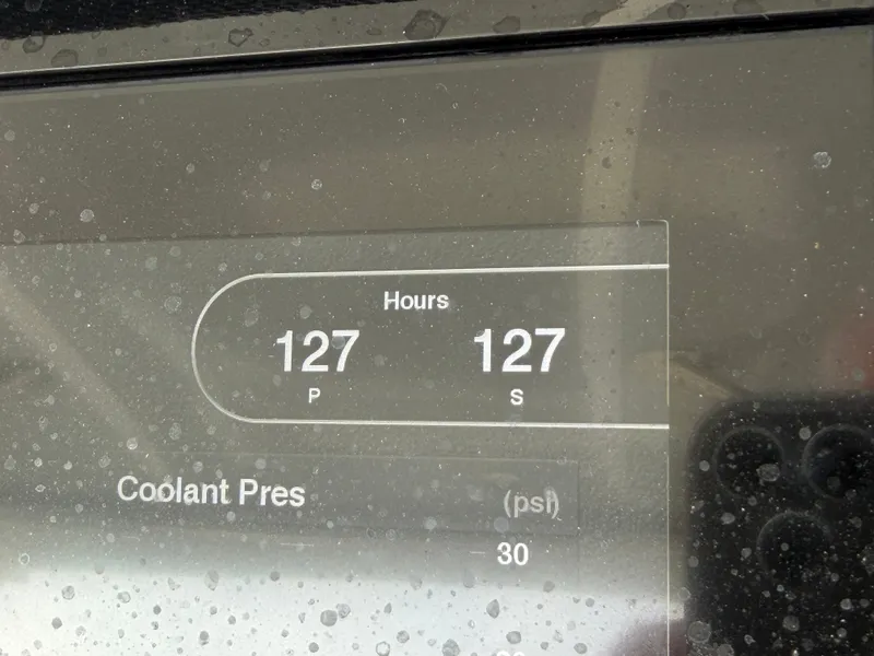 Slide: The Image of A display shows 127 hours for both engines and a coolant pressure of 30 psi. - 31