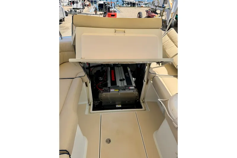 Slide: The Image of 2009 MJM 29z Downeast boat engine compartment with Yanmar engine, beige seating. - 23