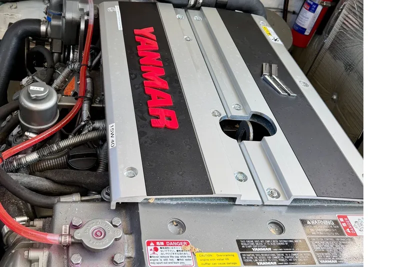 Slide: The Image of Engine compartment of a 2009 MJM 29z Downeast boat featuring a Yanmar engine. - 24