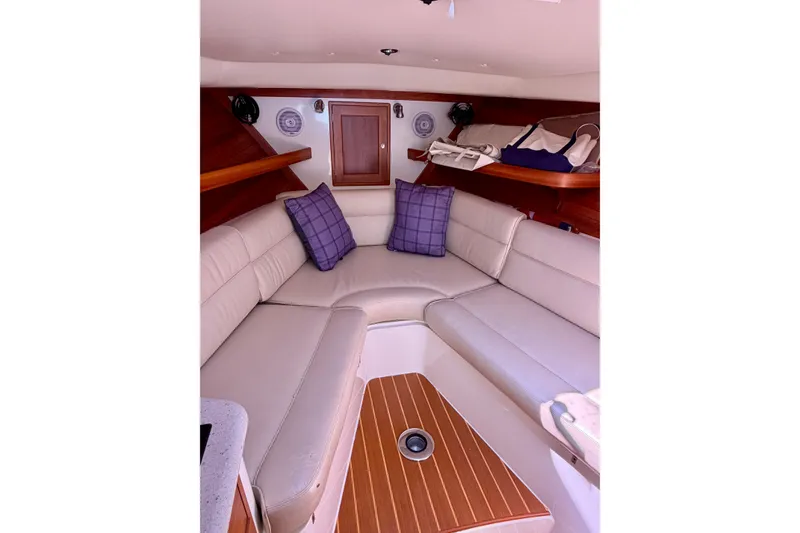 Slide: The Image of Interior of 2009 MJM 29z Downeast boat with beige seating and wooden accents. - 19