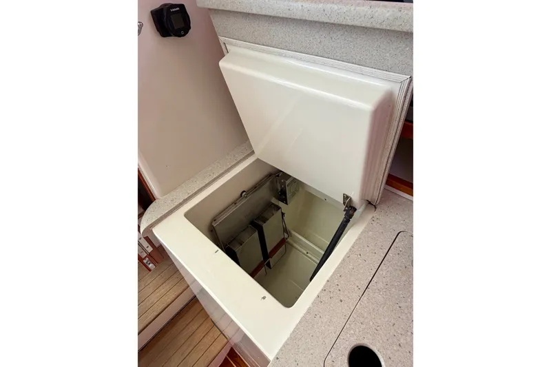 Slide: The Image of Open storage compartment on 2009 MJM 29z Downeast boat interior. - 21