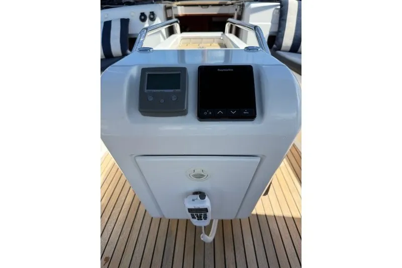 Slide: The Image of Cockpit controls of 2013 Jeanneau Sun Odyssey 469 sailboat with navigation equipment. - 28