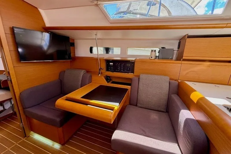 Slide: The Image of Interior of 2013 Jeanneau Sun Odyssey 469 yacht with modern seating and wooden finishes. - 20