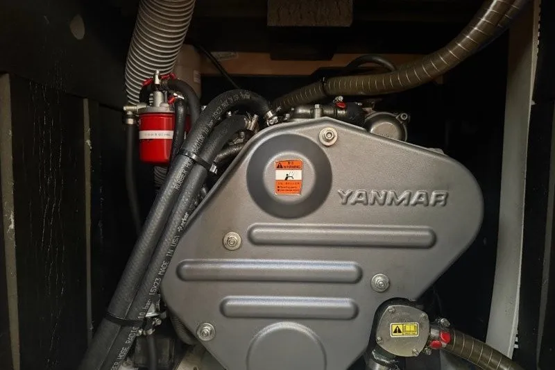 Slide: The Image of Yanmar engine in a 2013 Jeanneau Sun Odyssey 469 sailboat, showcasing detailed components. - 22