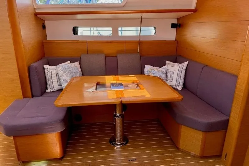 Slide: The Image of Interior of 2013 Jeanneau Sun Odyssey 469 yacht with cozy seating and wooden table. - 17