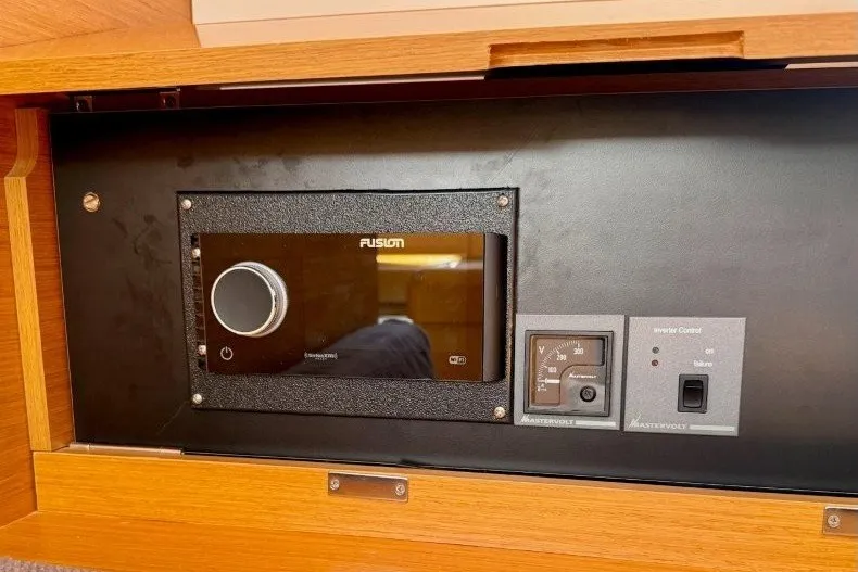 Slide: The Image of Control panel inside 2013 Jeanneau Sun Odyssey 469 yacht, featuring Fusion audio system. - 14