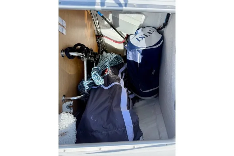 Slide: The Image of Storage compartment of 2013 Jeanneau Sun Odyssey 469 with ropes and sailing gear. - 31