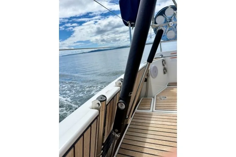 Slide: The Image of 2013 Jeanneau Sun Odyssey 469 sailboat deck with ocean view and clear sky. - 35