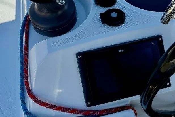 Slide: The Image of Cockpit controls of 2013 Jeanneau Sun Odyssey 469 sailboat with ropes and winch. - 30