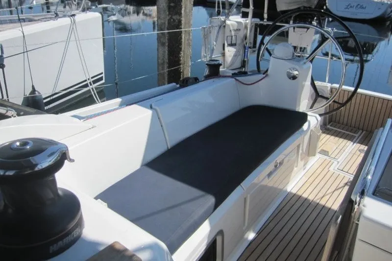 Slide: The Image of Cockpit of 2013 Jeanneau Sun Odyssey 469 sailboat with teak flooring and steering wheel. - 38