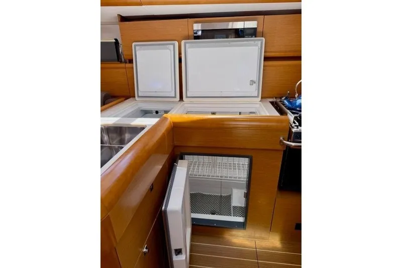 Slide: The Image of Modern kitchen area in 2013 Jeanneau Sun Odyssey 469 yacht with open fridge compartments. - 21