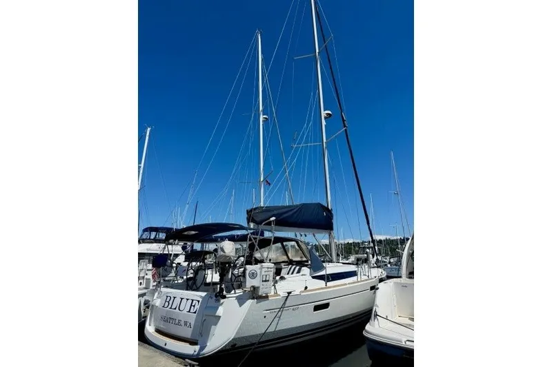 Slide: The Image of 2013 Jeanneau Sun Odyssey 469 sailboat docked under clear blue sky. - 27