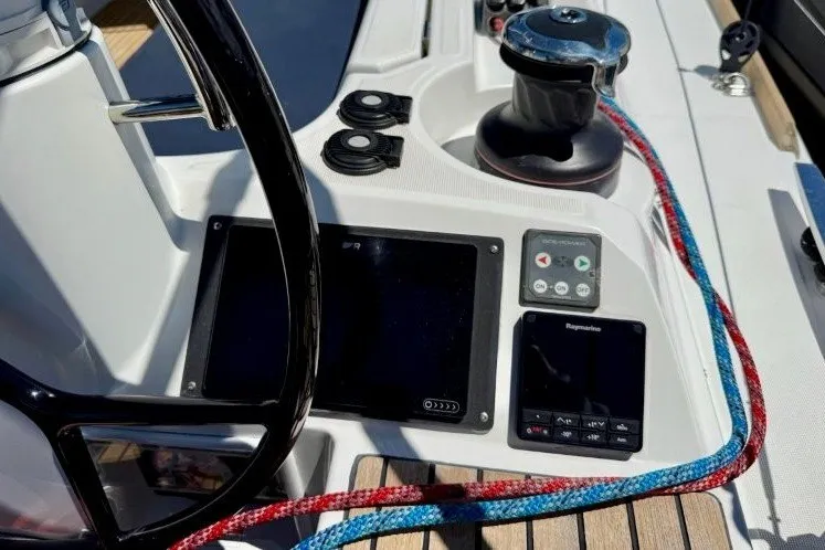Slide: The Image of Cockpit controls of 2013 Jeanneau Sun Odyssey 469 sailboat with steering wheel and navigation instruments. - 29