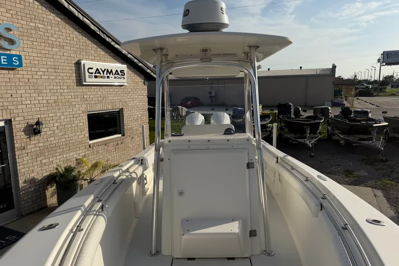 Slide: The Image of 2002 Silverhawk 240 Center Console boat at dealership, featuring sleek design and spacious deck. - 24