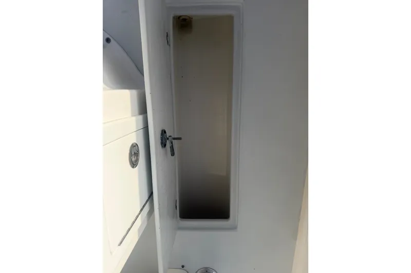 Slide: The Image of Interior view of a 2002 Silverhawk 240 Center Console boat compartment. - 35