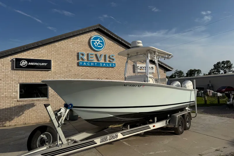 Slide: The Image of Silverhawk 240 Center Console boat on trailer at Revis Yacht Sales, 2002 model. - 1