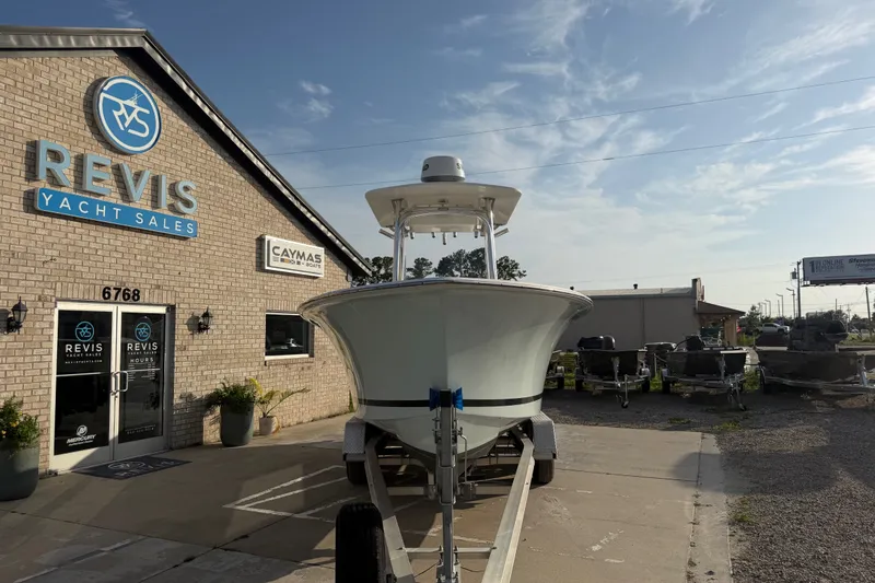 Slide: The Image of 2002 Silverhawk 240 Center Console boat at Revis Yacht Sales dealership. - 9