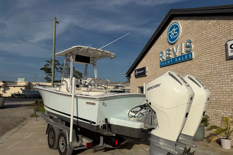 Slide: The Image of 2002 Silverhawk 240 Center Console boat at Revis Yacht Sales with dual Mercury engines. - 5