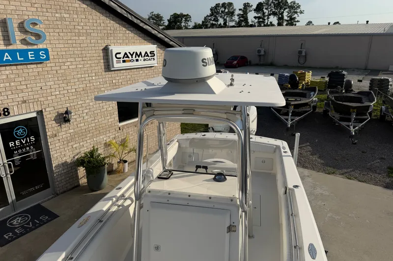 Slide: The Image of 2002 Silverhawk 240 Center Console boat at Revis Yacht Sales, near Caymas Boats sign. - 23