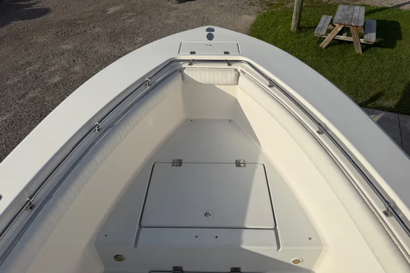 Slide: The Image of 2002 Silverhawk 240 Center Console boat interior with seating and storage compartments. - 26