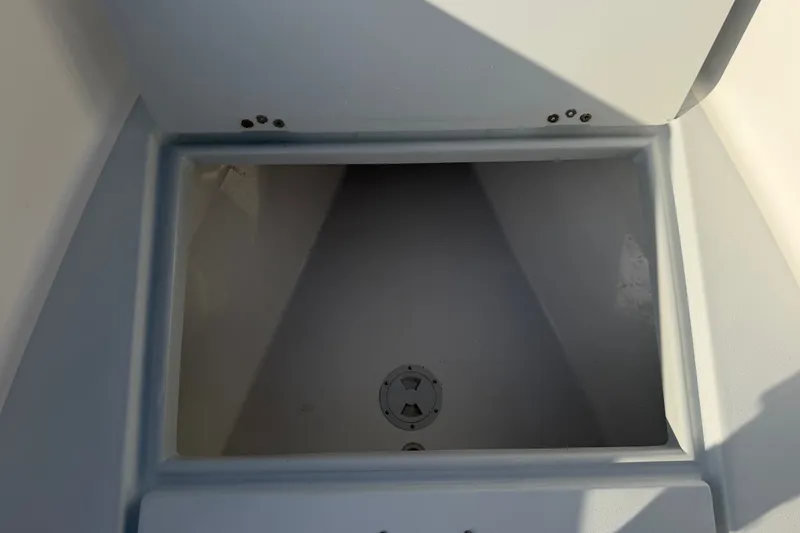 Slide: The Image of Storage compartment of a 2002 Silverhawk 240 Center Console boat, open and empty. - 30