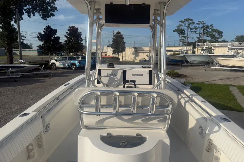 Slide: The Image of 2002 Silverhawk 240 Center Console boat with Simrad electronics, docked outdoors. - 14