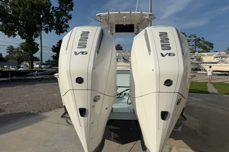 Slide: The Image of Twin Mercury 225 V6 engines on a 2002 Silverhawk 240 Center Console boat. - 7