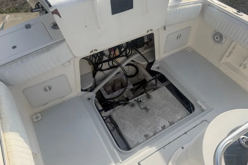 Slide: The Image of Open engine compartment of a 2002 Silverhawk 240 Center Console boat, showing wiring and components. - 37