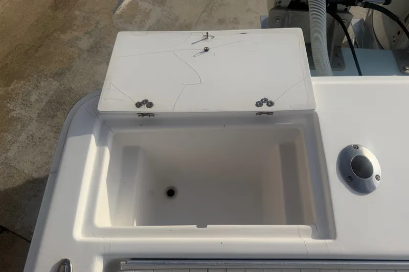Slide: The Image of Open storage compartment on a 2002 Silverhawk 240 Center Console boat. - 18