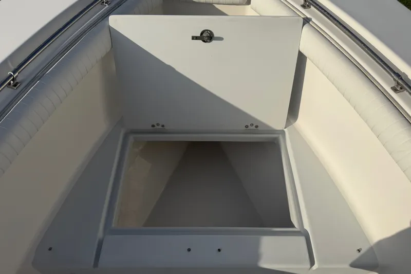 Slide: The Image of Open storage compartment on a 2002 Silverhawk 240 Center Console boat. - 31
