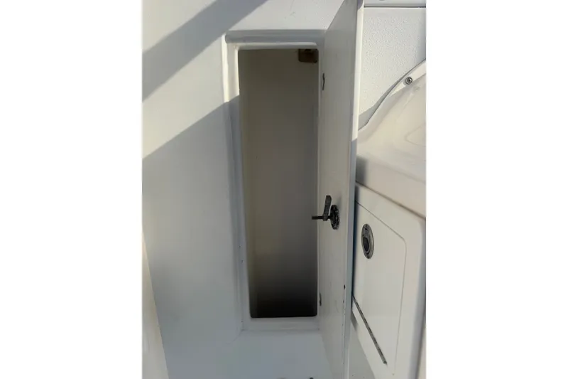 Slide: The Image of Open storage compartment on a 2002 Silverhawk 240 Center Console boat. - 34