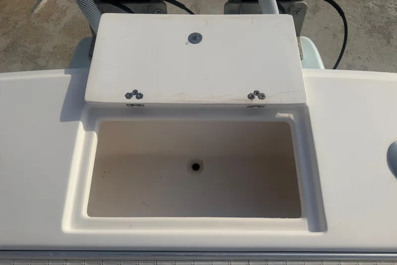 Slide: The Image of Open storage compartment on a 2002 Silverhawk 240 Center Console boat. - 20