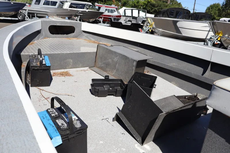 Slide: The Image of 2007 Tacoma Jet 17' boat interior with exposed batteries and equipment, showcasing a mechanic's special condition. - 13
