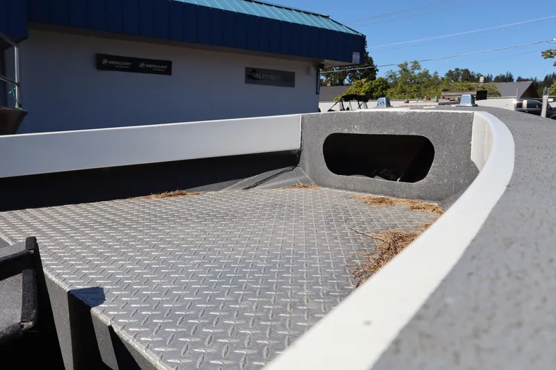 Slide: The Image of 2007 Tacoma Jet 17' Mechanic's Special boat with diamond plate flooring, exterior view. - 16