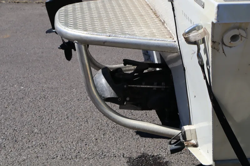 Slide: The Image of Rear view of a 2007 Tacoma Jet 17' Mechanic's Special boat, showing metal framework. - 4