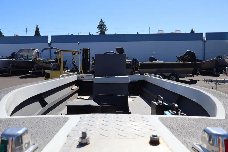Slide: The Image of 2007 Tacoma Jet 17' Mechanic's Special boat in a lot, viewed from the bow. - 15